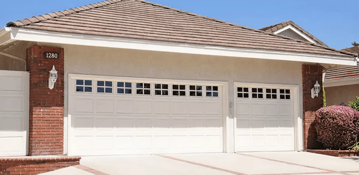 Residential garage door repair service for a double garage door in Cambridge, MA
