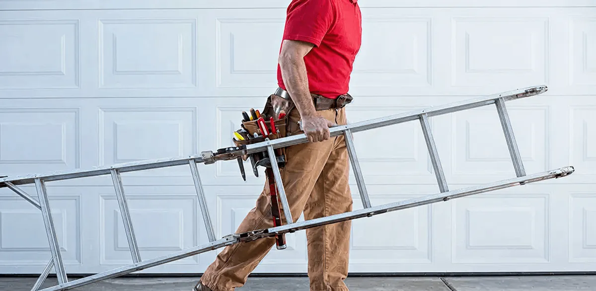Garage door repair technician arriving with tools and ladder in Cambridge, MA