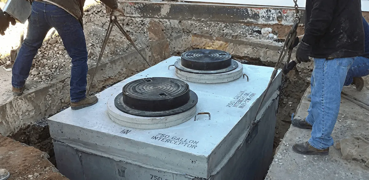 Grease trap installation for a commercial property drainage system in Cambridge, MA