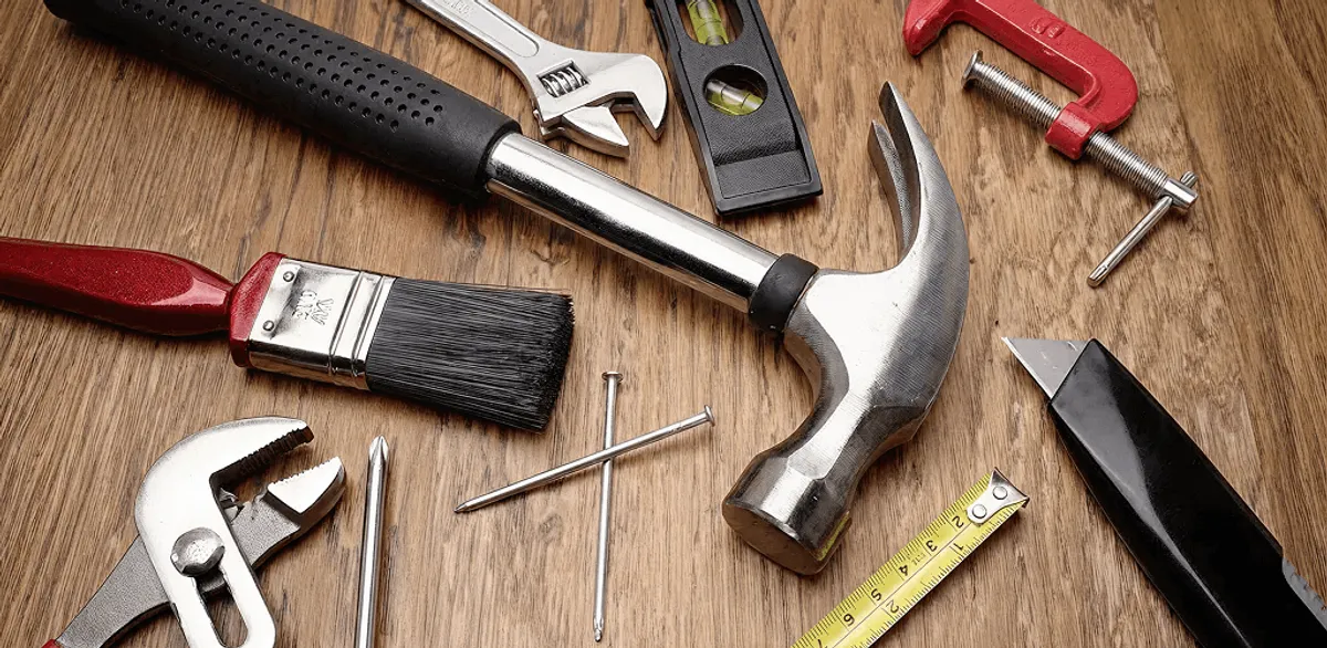 Handyman tools laid out for home repair and maintenance work in Cambridge, MA
